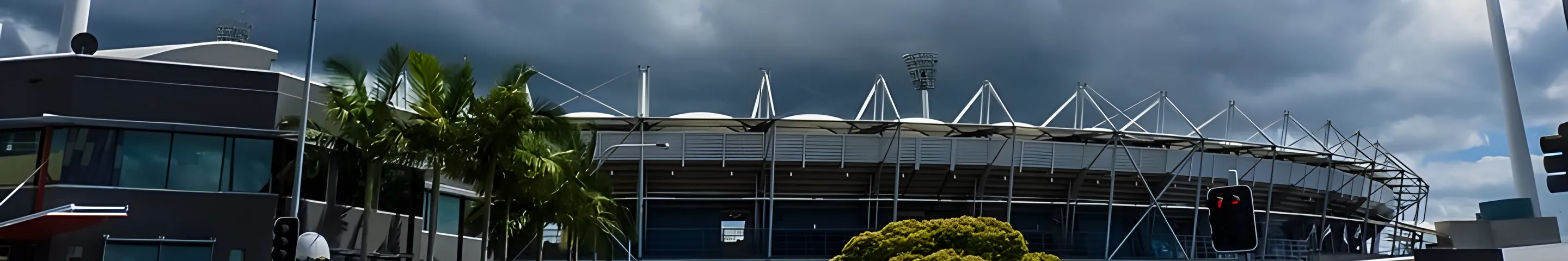 The Gabba stadium under big summer clouds
